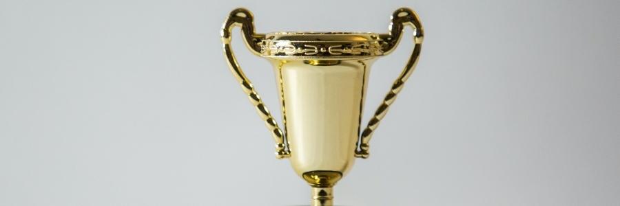 A trophy representing winning online for a car dealership