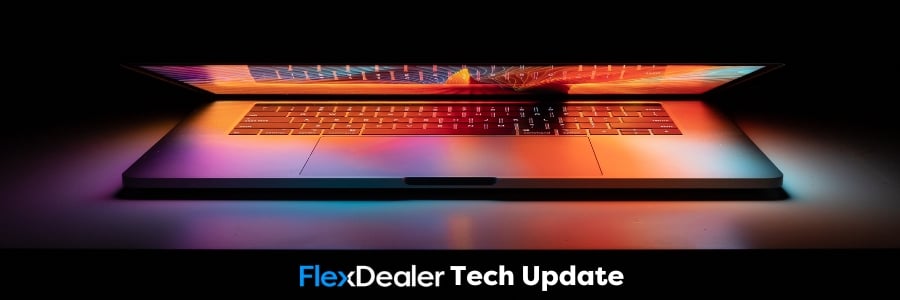 Colourful laptop with rainbow lights on black background